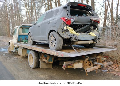 A Tow Truck And A Car After A Serious Rear End Collision. 