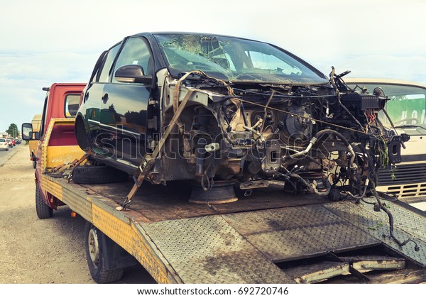 Tow truck loads smashed car after traffic\
accident                               \
