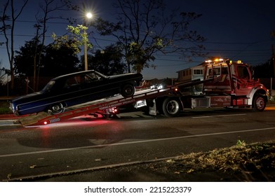 Tow Truck Removes Vintage 1960's Chevy Impala Car From Highway Late Night Break Down, Revere Massachusetts USA, October 15 2022