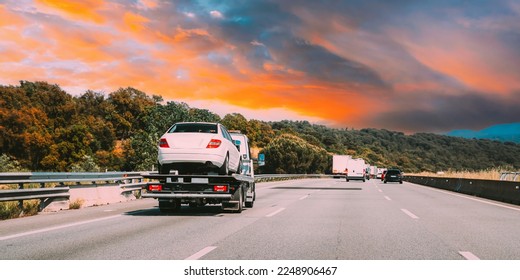 Tow Truck Transporting Car Or Help On Road Transports Wrecker Broken Car. Car Service Transportation Concept. Auto Towing, Tow Truck For Transportation Faults And Emergency Cars . Tow Truck Moving In - Shutterstock ID 2248906467