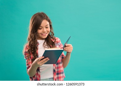 Towards knowledge. Girl hold book read story over blue background. Child enjoy study and reading book. Book store concept. Wonderful free childrens books available to read. Childrens literature.