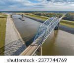 towboats with barges on Chain of Rock Canal of Mississipi River above St Louis, aerial view in October scenery