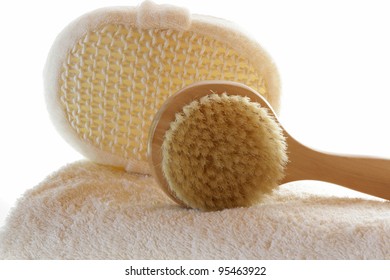  Towel With Body Brush On A White Background