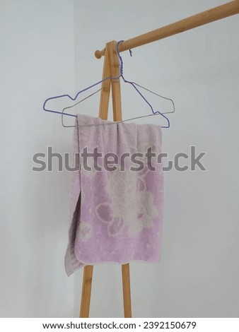 A towel hangs neatly on a hook, creating a clean and organized look.