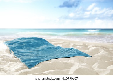 Towel on hot sand of free space for your decoration and landscape of sea 