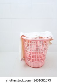 Towel On A Pink Plastic Luandry Basket