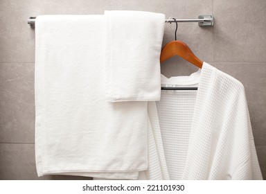 Towel And Robe On The Rack In The Bathroom