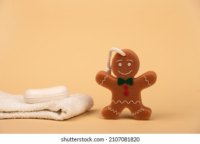 Towel Soap And Washcloth In The Form Of A Cheerful Cookie For Comfortable Washing Of The Child. Child Care And Child Hygiene.