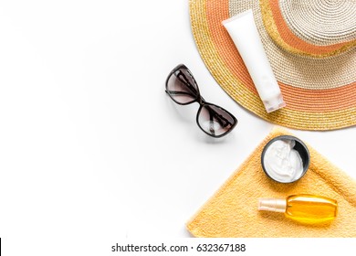 Towel, Sun Lotion, Glasses On White Background Top View Space For Text