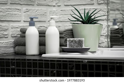 Towels With Liquid Soap On Table In Bathroom.  Mockup For Bathing Products In The Bathroom. Spa Shampoo, Shower Gel, Liquid Soap. Beauty Care Accessories For Bath.