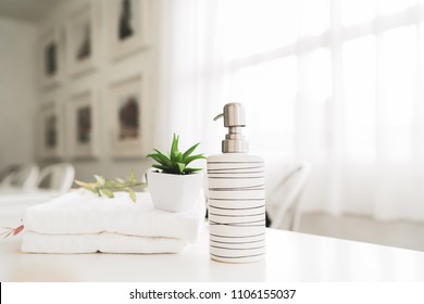 Towels on white wood top table with copy space on blurred background. For product display montage. - Shutterstock ID 1106155037