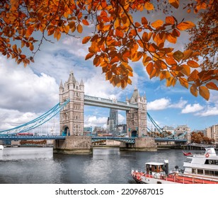 Tower Bridge With Autumn Leaves In London, England, UK