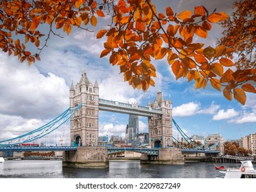 Tower Bridge With Autumn Leaves In London, England, UK