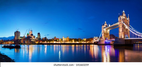 Tower Bridge in London, the UK at night. Panorama of the city centre