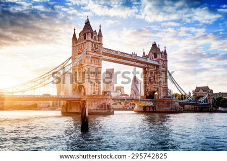 Tower Bridge in London, the UK. Sunset with beautiful clouds. Drawbridge opening. One of English symbols