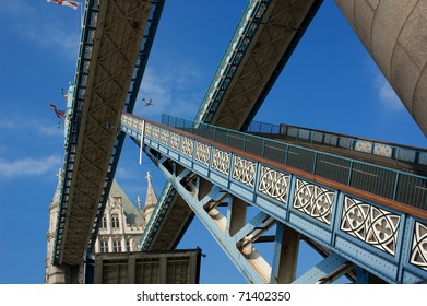 Tower Bridge with open gates and plane above it. - Powered by Shutterstock