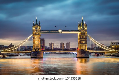 Tower Bridge withreflections in the thames at sunset - Shutterstock ID 134535818