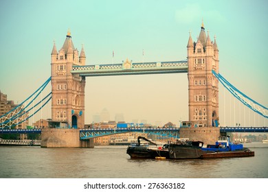Tower Bridge in yellow tone in London over Thames River as the famous landmark.