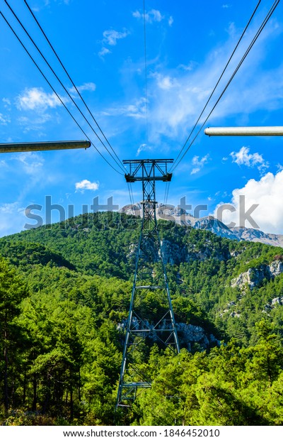 Tower of cable car on Tahtali mountain\
not far from Kemer town. Antalya province,\
Turkey