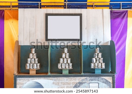 Tower of cans in front for throwing game at fun fair, Game shoot canned for outing party, Recreational pleasure.