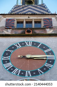 A Tower In Canton Zug With Medieval Clock And Windows Above