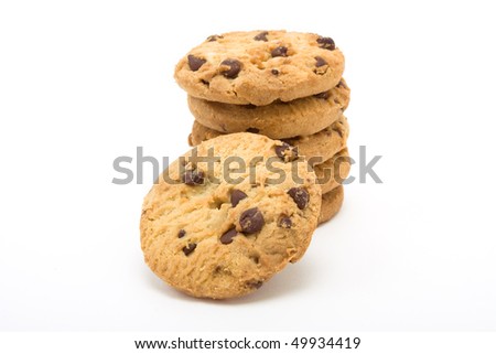 Tower of Choc Chip n Hazelnut Biscuits from low viewpoint isolated against white background.