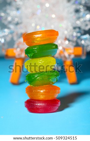 tower of colorfull candy, lollipop, bonbon. christmas decoration on background. 