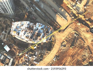 Tower Crane On Building Construction, Top View. Builder On Formworks. Cranes On Pouring Concrete In Formwork. Сonstruction Site, Aerial View. Tower Cranes On Construction In Built Environment. 