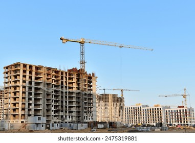 Tower Crane on formworks. Crane and building construction. Construction crane on Housing. Construction site, Multi Storey Residential Buildings construction. - Powered by Shutterstock