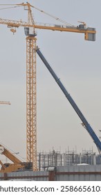 A tower crane operator skillfully maneuvers heavy loads, ensuring safe and efficient construction at towering heights.