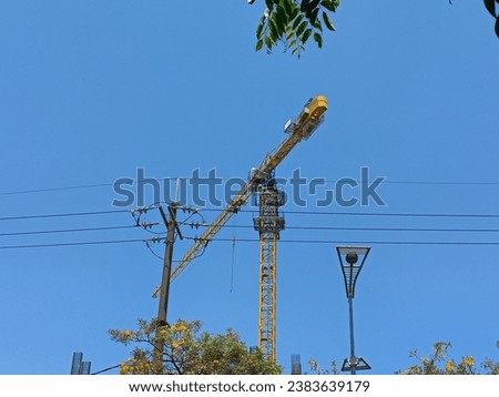 Tower crane used in building tall buildings seen from afar