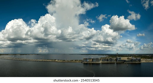 Tower cranes and frame structure of high residential apartment buildings at construction site on sea shore. Real estate development - Powered by Shutterstock