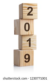 Tower of four wooden cubes symbolizing  year 2019, isolated on white background