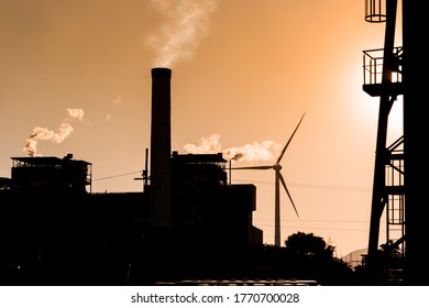 tower and high voltage wind and thermoelectric plant, with blue sky background with space for copy