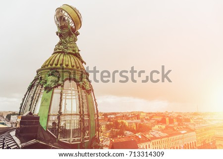 Tower of House of Singer or Zinger, also House of Books on Nevsky Prospekt, St. Petersbyrg, Russia, the office of VKontakte company (Russian social network). Old bronze tower in sunlight
