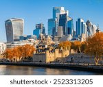 Tower of London with City of London skyscrapers in autumn, UK