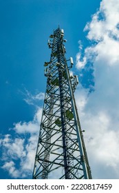 A Tower For Mobile Communication Antennas Against A Blue Sky With White Clouds. Mobile Operator Antennas. Radio Communication Tower. Internet And Telephony. Internet Business. The Beauty.