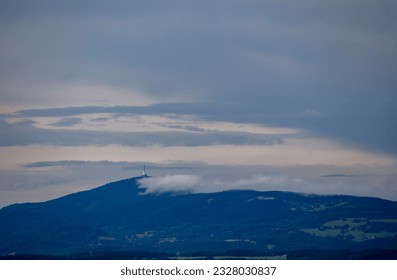 Tower on the hill in clouds