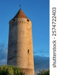 A tower on the old town walls of Romont in Switzerland taken at sunset