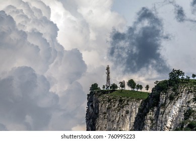 Tower on rocks in the clouds