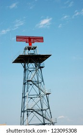 a tower with red radar