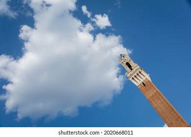Tower in Siena reaching a cloud