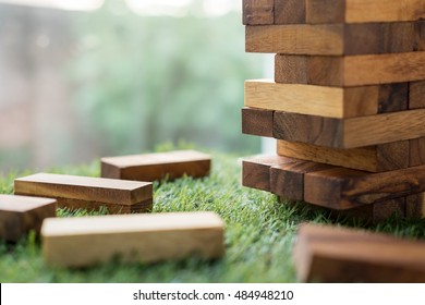 The Tower Stack From Wooden Blocks Toy On Grass