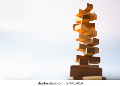 The Tower Stack From Wooden Blocks Toy With Sky Background. Learning And Development Concept.