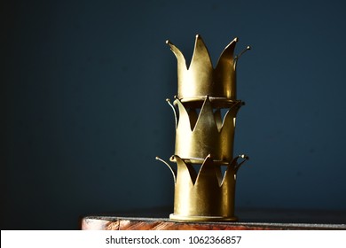 Tower Of Three Shiny Brass Crowns.