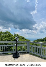 Tower Viewer Binoculars at The Blowing Rock Attraction in the Blue Ridge Mountains in Appalachia with Blue Sky and Storm Clouds in Summer
