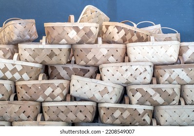 A Tower Of Wicker Baskets Are Piled High, For Shoppers To Fill With Fresh Fruit, Veggies And Fall Gourds And Pumpkins