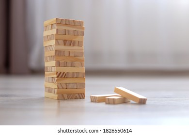 A Tower Of Wooden Blocks On The Floor