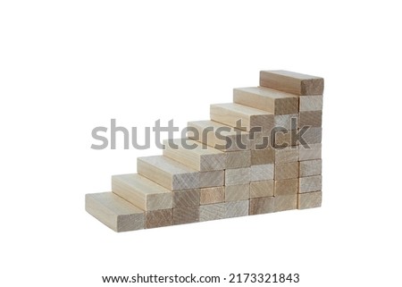 Tower of wooden blocks on a white background in the form of stairs.