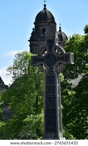 Towering large stone celtic cross in Edinburgh Scotland.